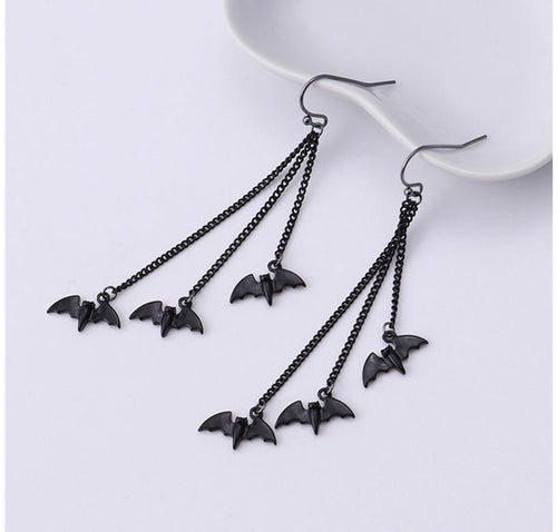 Earrings with bat pendants